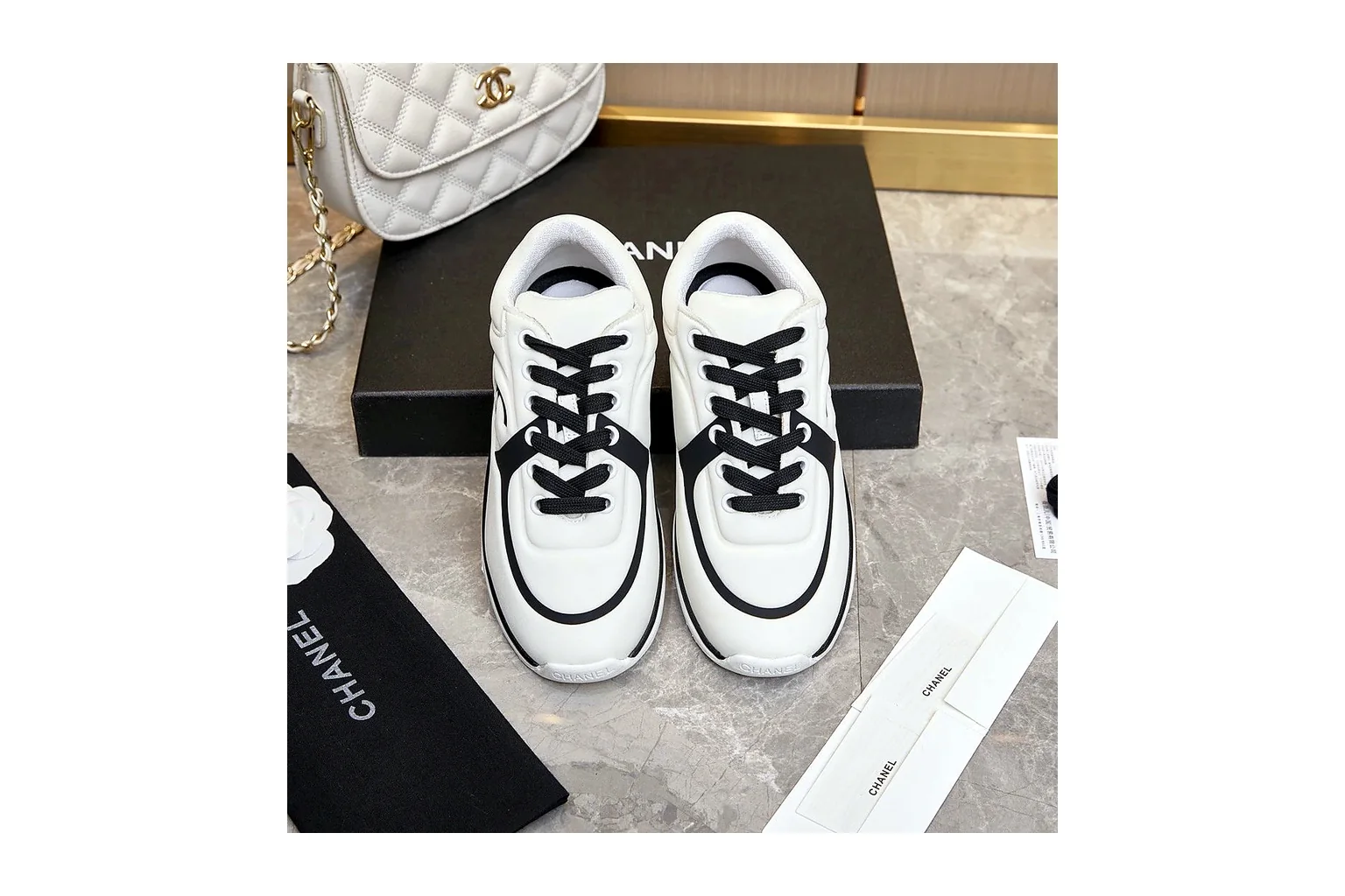 Chanel CC Low Top White Black luxury low top six photo view thumbnail 3