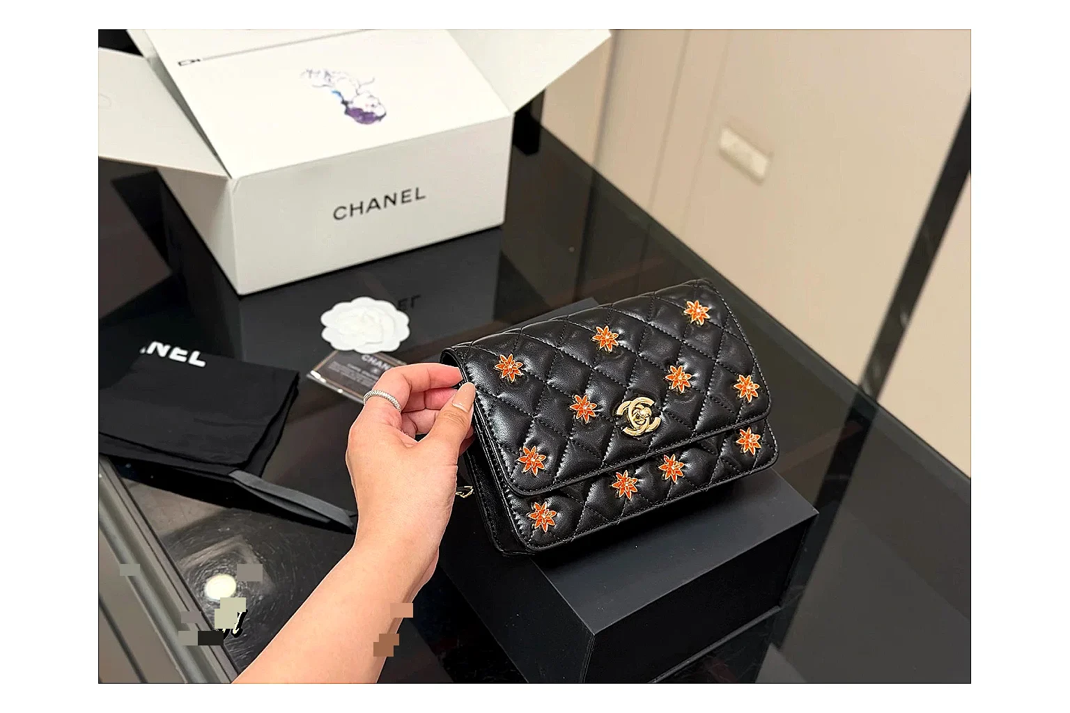 Chanel Quilted Wallet Bag Black Floral budget find photo showing black quilted wallet-bag body, floral detail, compact flap shape, and polished chain hardware