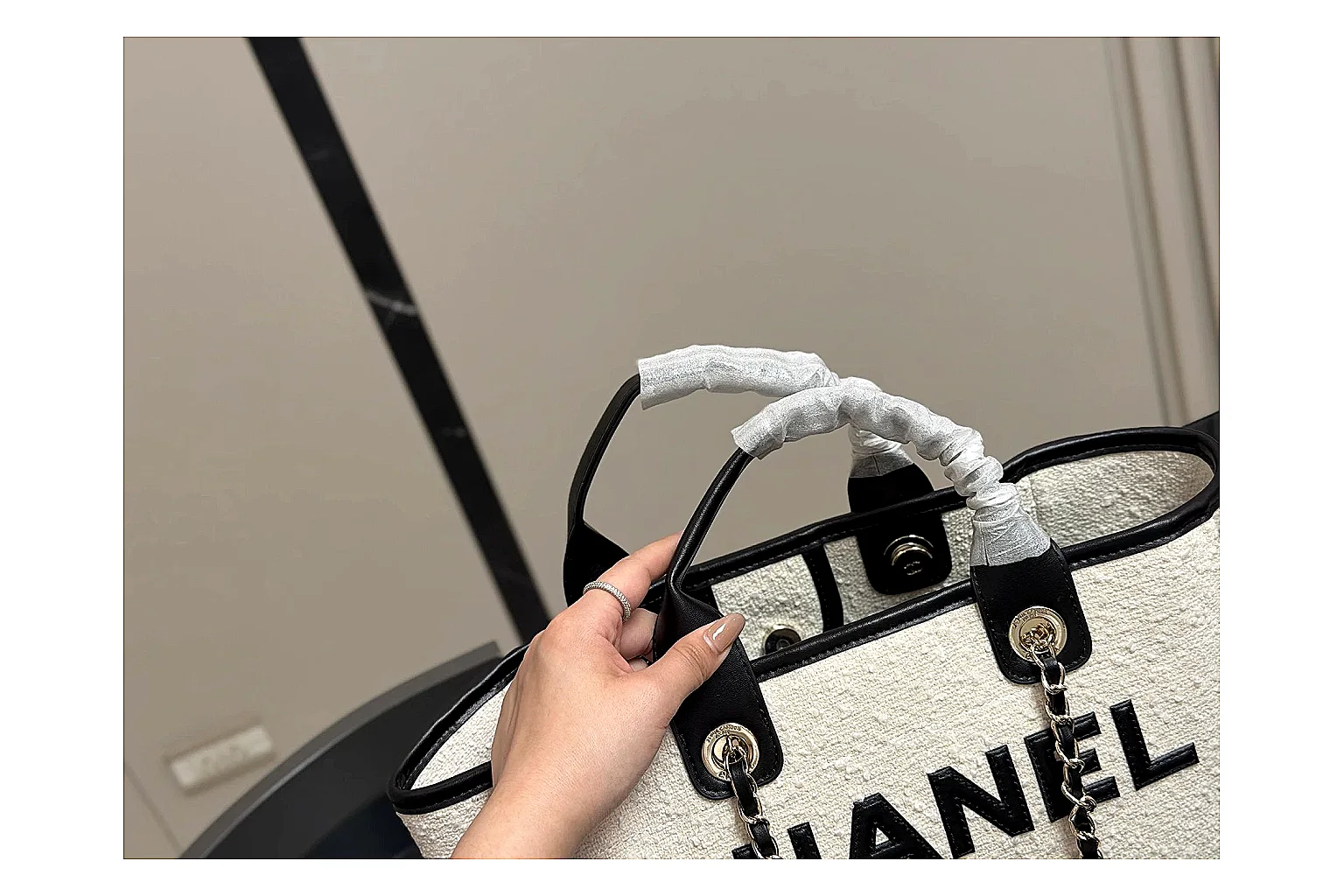 Chanel Tote Bag White Black budget find photo showing white black canvas-leather tote body, open carry shape, structured handles, and branded luxury-bag details thumbnail 3