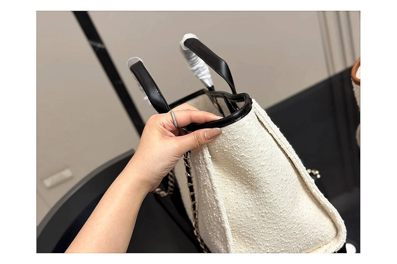 Chanel Tote Bag White Black budget find photo showing white black canvas-leather tote body, open carry shape, structured handles, and branded luxury-bag details thumbnail 4