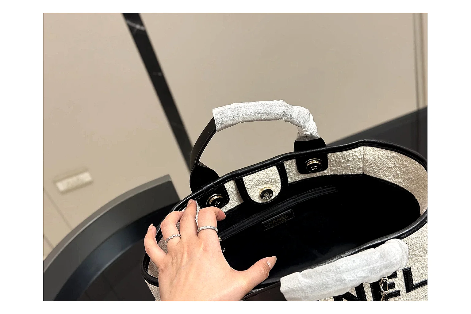 Chanel Tote Bag White Black budget find photo showing white black canvas-leather tote body, open carry shape, structured handles, and branded luxury-bag details thumbnail 5