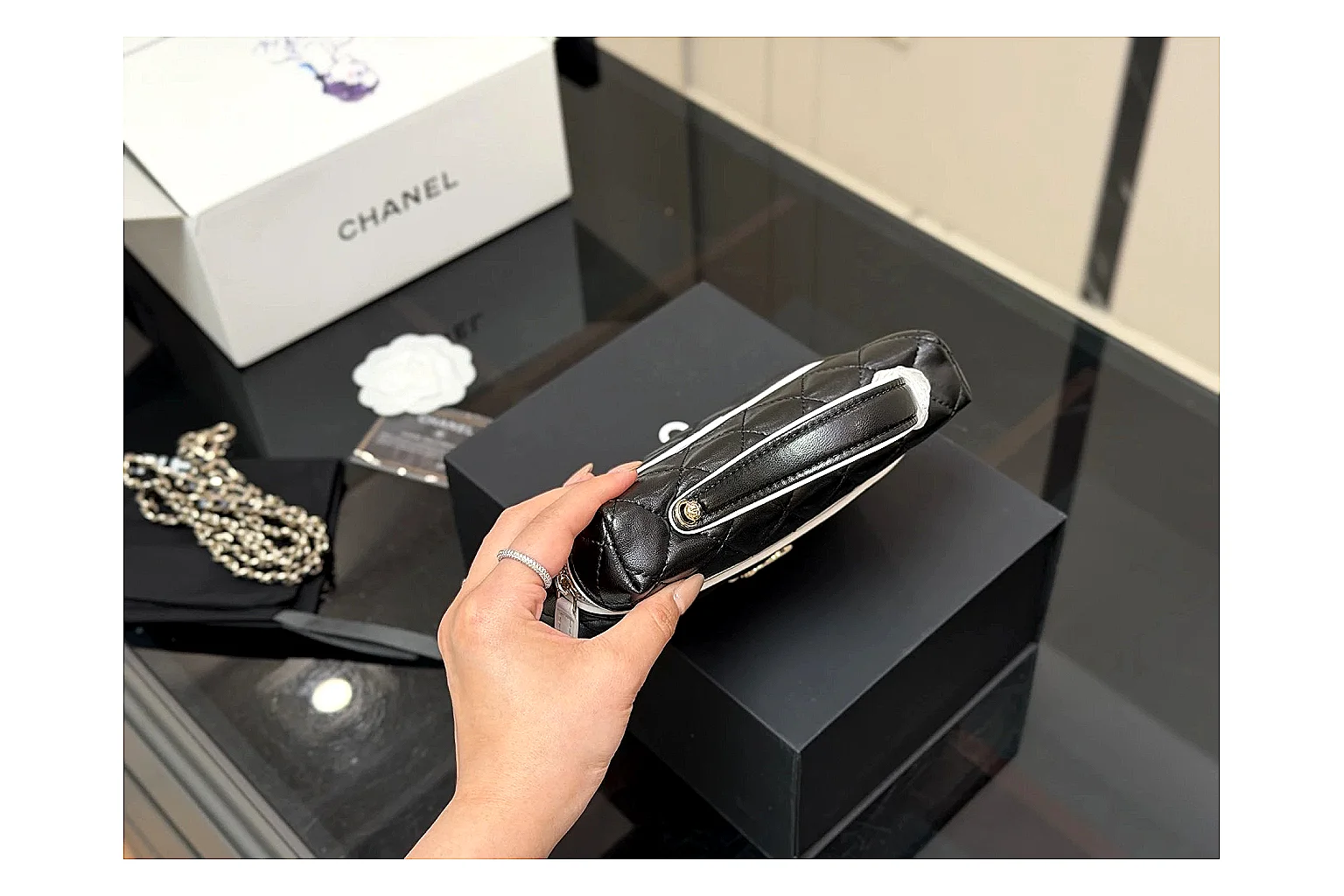 Chanel Wallet On Chain Black budget find photo showing black quilted leather wallet body, chain strap, flap closure, and compact shoulder-bag profile thumbnail 3