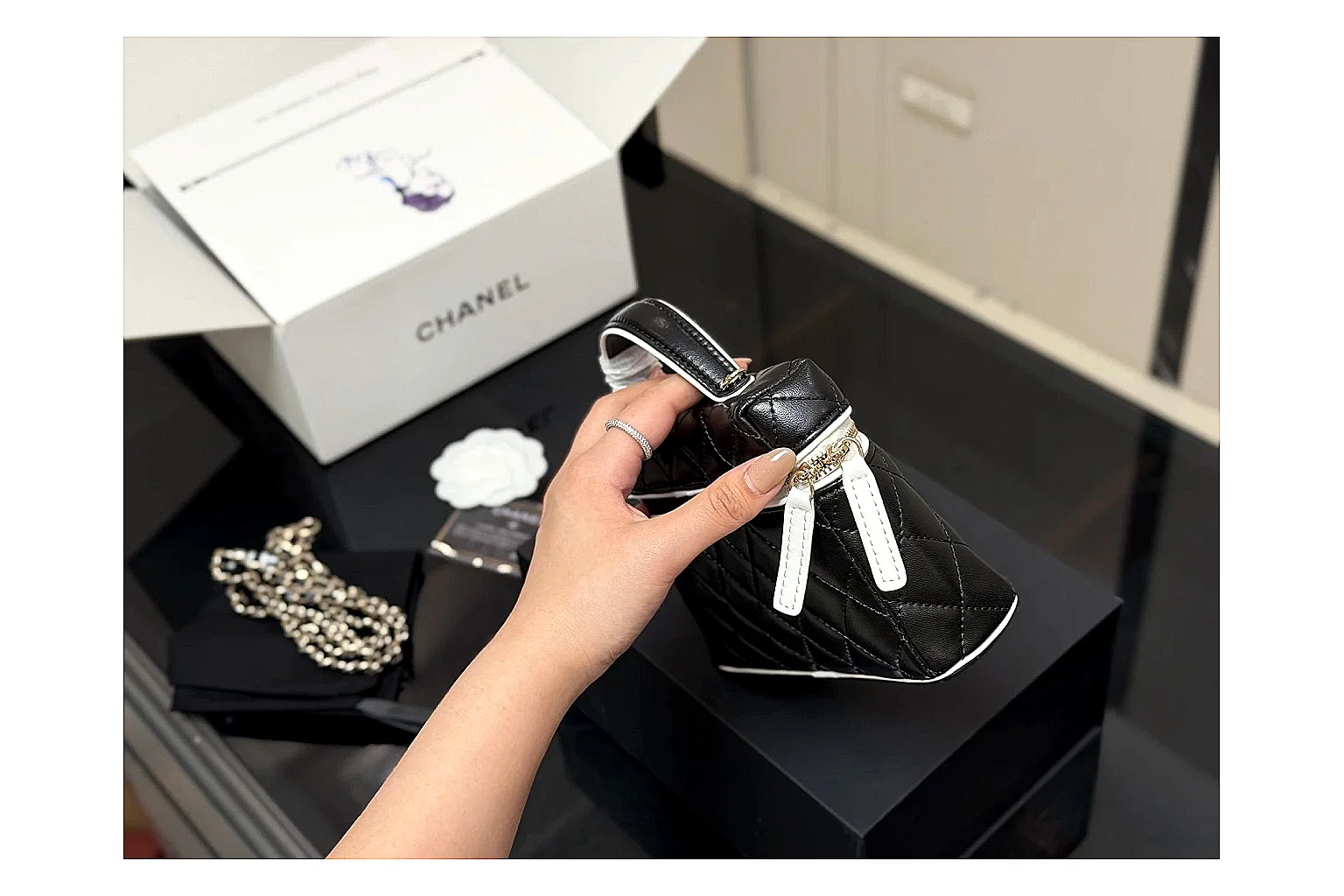 Chanel Wallet On Chain Black budget find photo showing black quilted leather wallet body, chain strap, flap closure, and compact shoulder-bag profile thumbnail 4