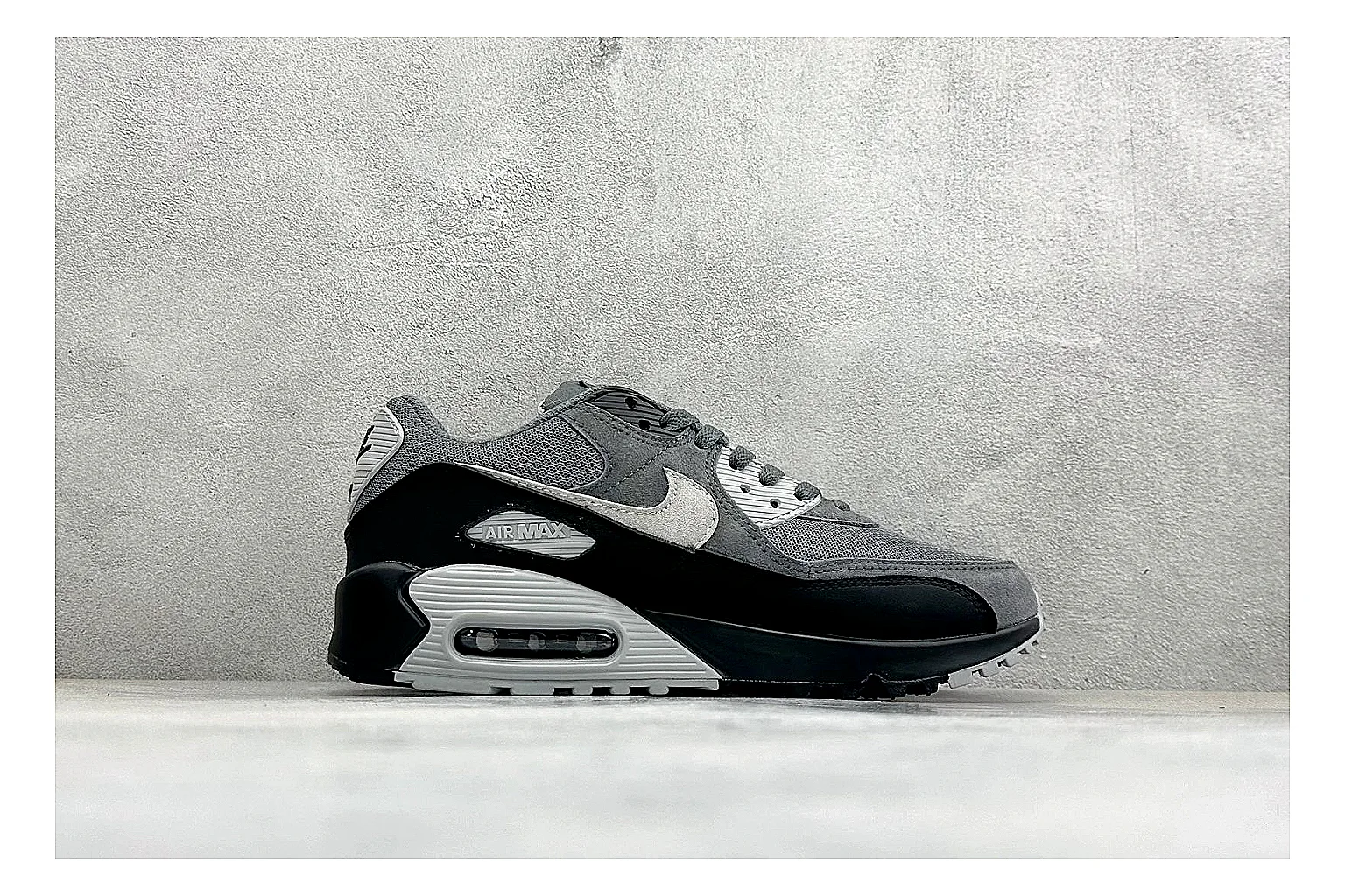 Nike Air Max 90 Grey Black budget find photo showing grey and black layered upper, visible Air window, classic Air Max 90 panels, and sturdy retro sole thumbnail 2