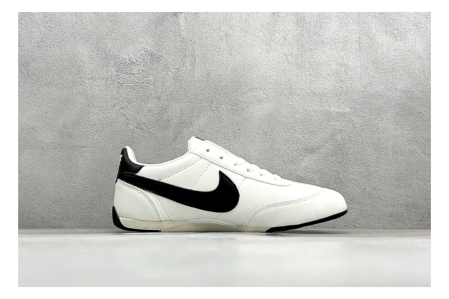 Nike Sprint Sister White Black budget find photo showing white retro-runner upper, black Swoosh contrast, slim low-top profile, and light casual sole thumbnail 2