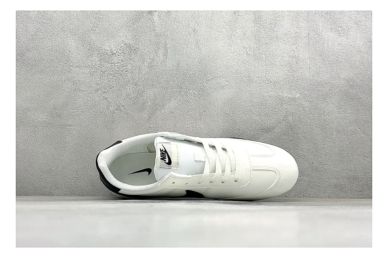 Nike Sprint Sister White Black budget find photo showing white retro-runner upper, black Swoosh contrast, slim low-top profile, and light casual sole thumbnail 3