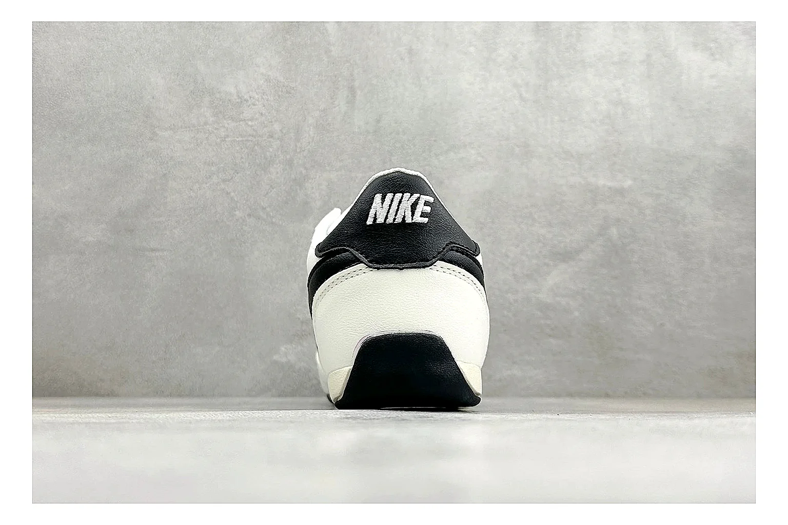 Nike Sprint Sister White Black budget find photo showing white retro-runner upper, black Swoosh contrast, slim low-top profile, and light casual sole thumbnail 4
