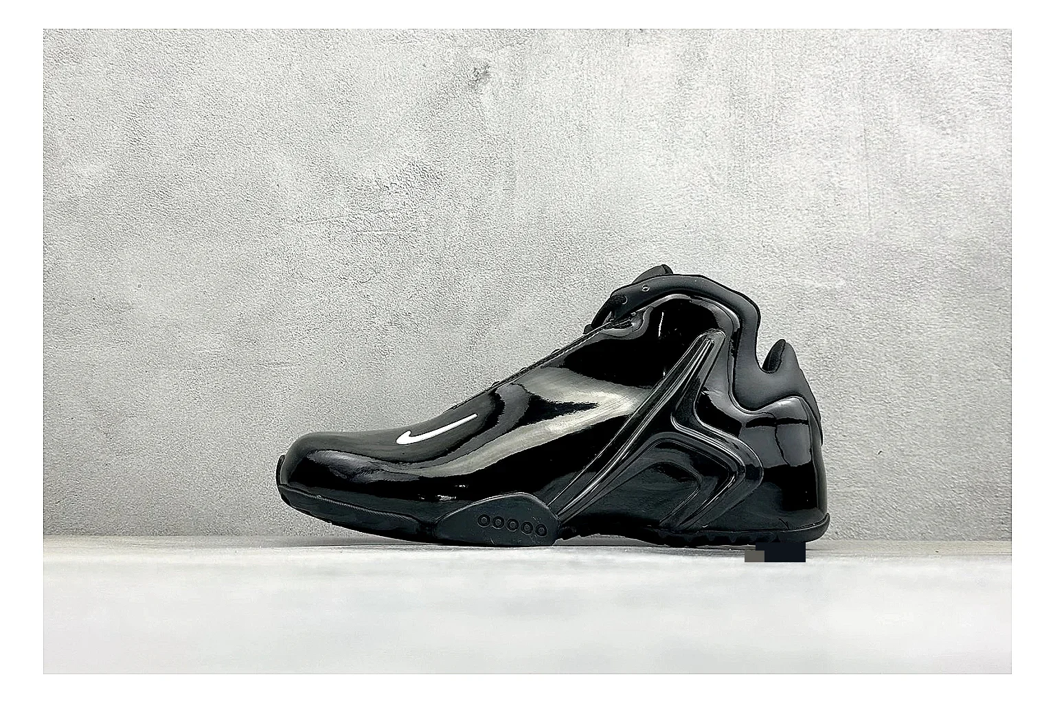 Nike Zoom Hyperflight Black budget find photo showing glossy black basketball upper, sleek shell shape, subtle Swoosh detail, and sculpted court sole