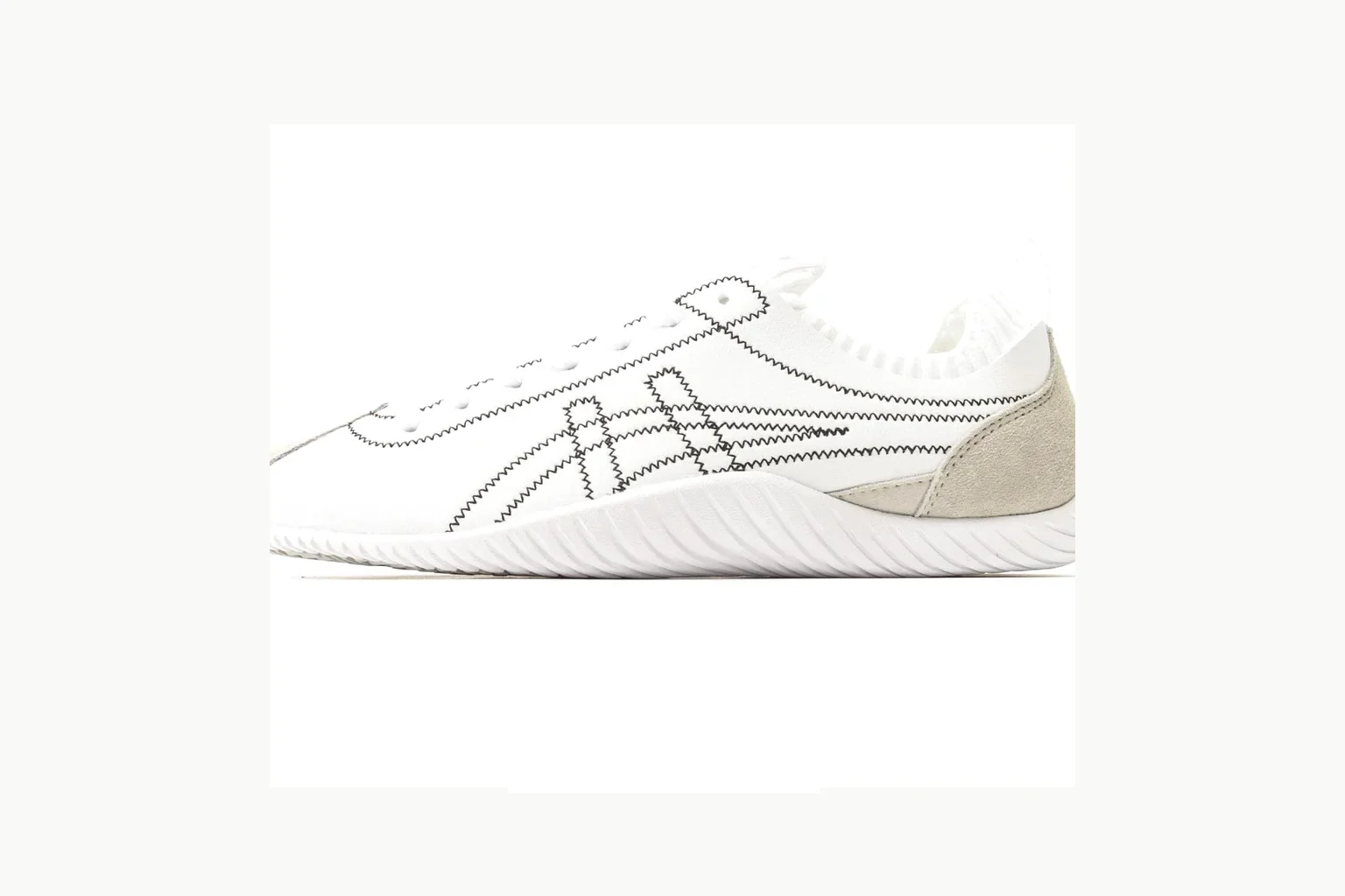 White-silver Onitsuka Tiger low top on a light-neutral value list