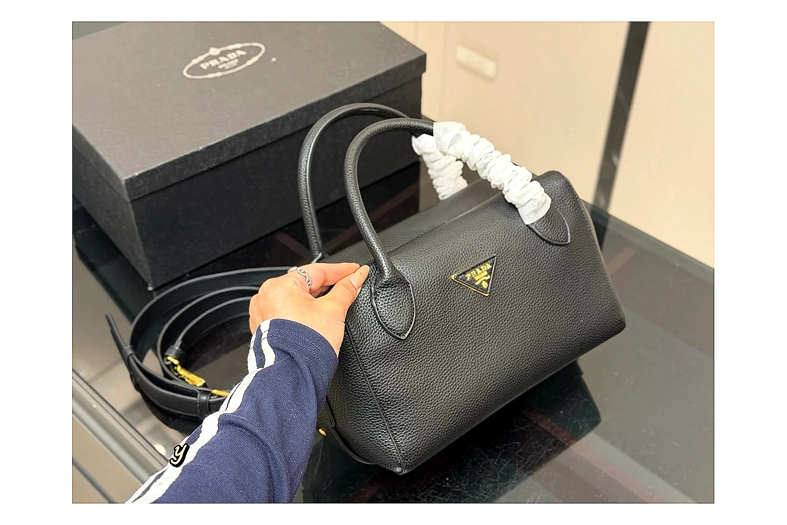 Prada Mini Top Handle Black budget find photo showing black leather mini bag body, structured top handle, compact silhouette, and clean metal hardware thumbnail 2