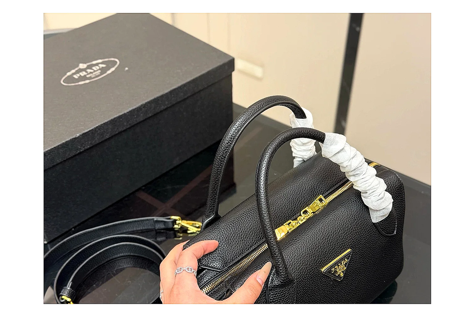 Prada Mini Top Handle Black budget find photo showing black leather mini bag body, structured top handle, compact silhouette, and clean metal hardware thumbnail 3