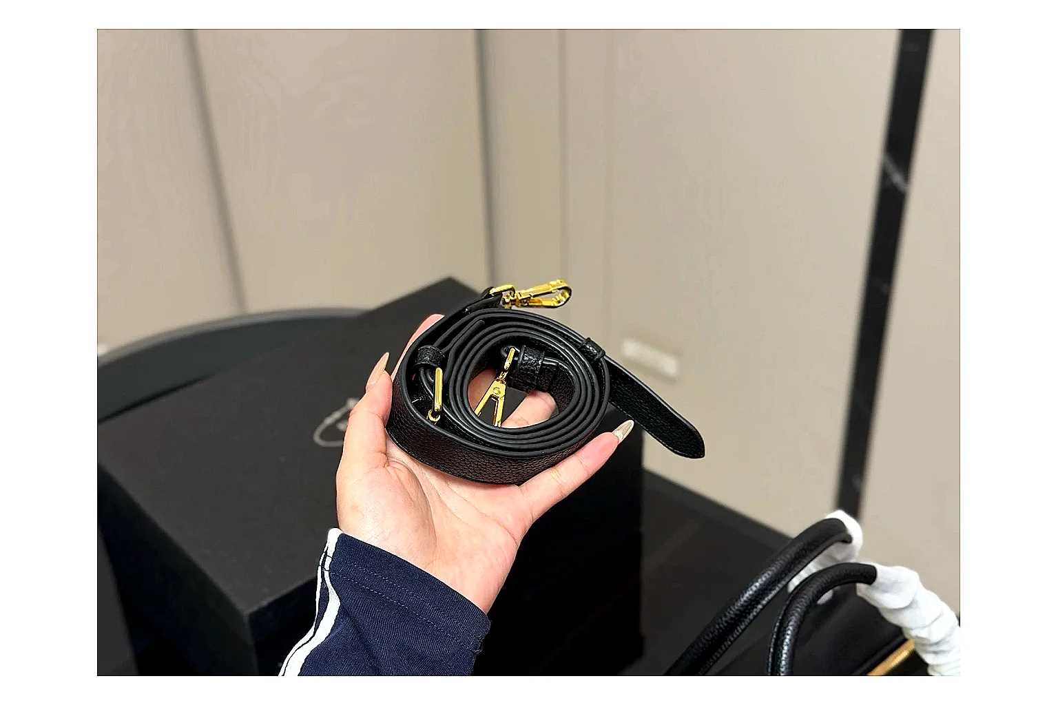 Prada Mini Top Handle Black budget find photo showing black leather mini bag body, structured top handle, compact silhouette, and clean metal hardware thumbnail 4