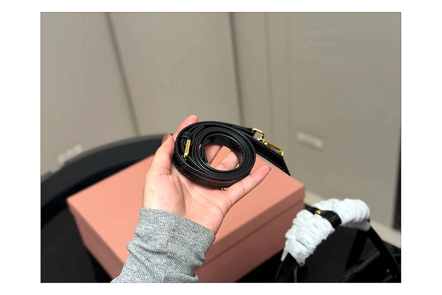 Prada Mini Top Handle Black budget find photo showing black leather mini bag body, structured top handle, compact luxury shape, and clean hardware details thumbnail 4