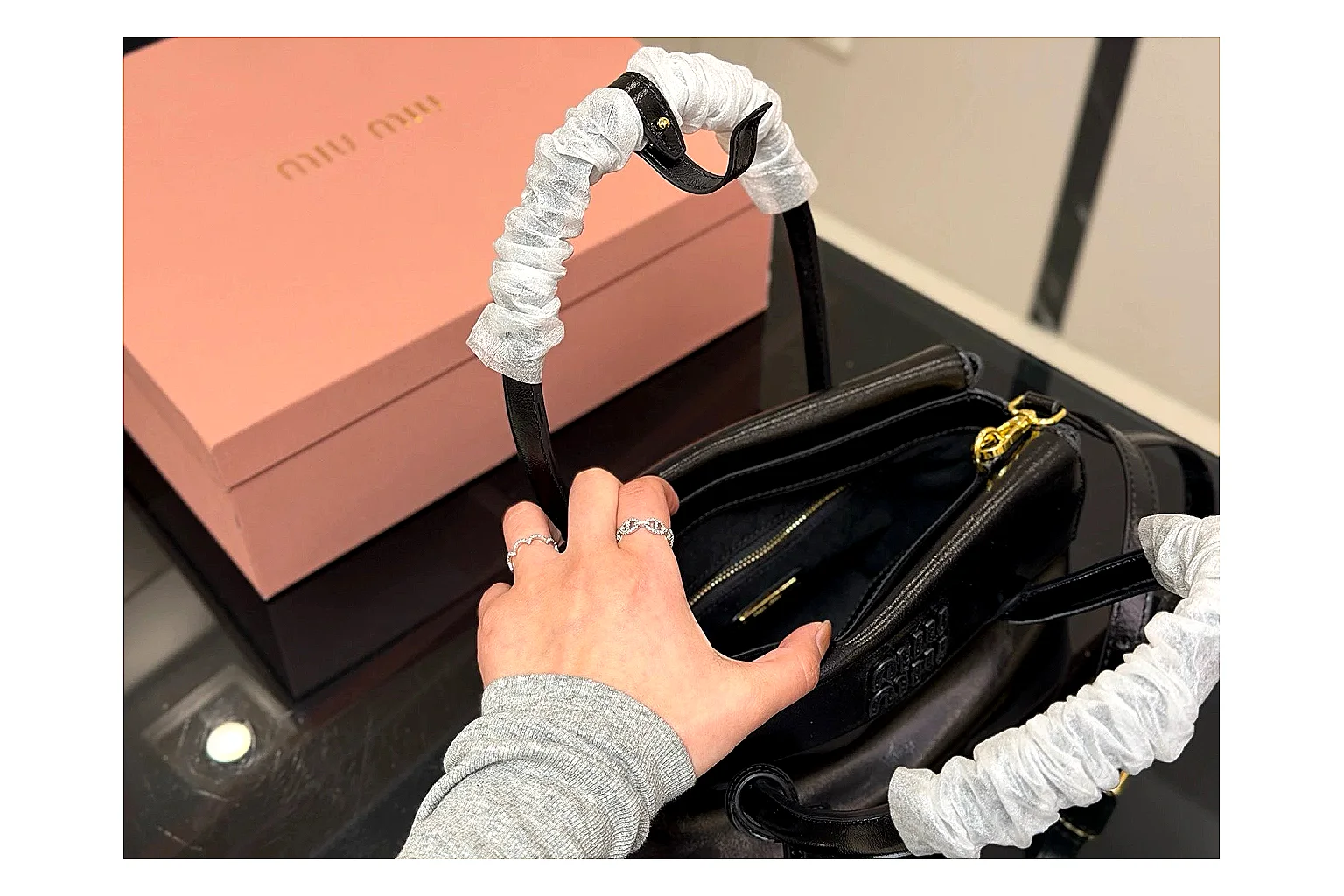 Prada Mini Top Handle Black budget find photo showing black leather mini bag body, structured top handle, compact luxury shape, and clean hardware details thumbnail 5