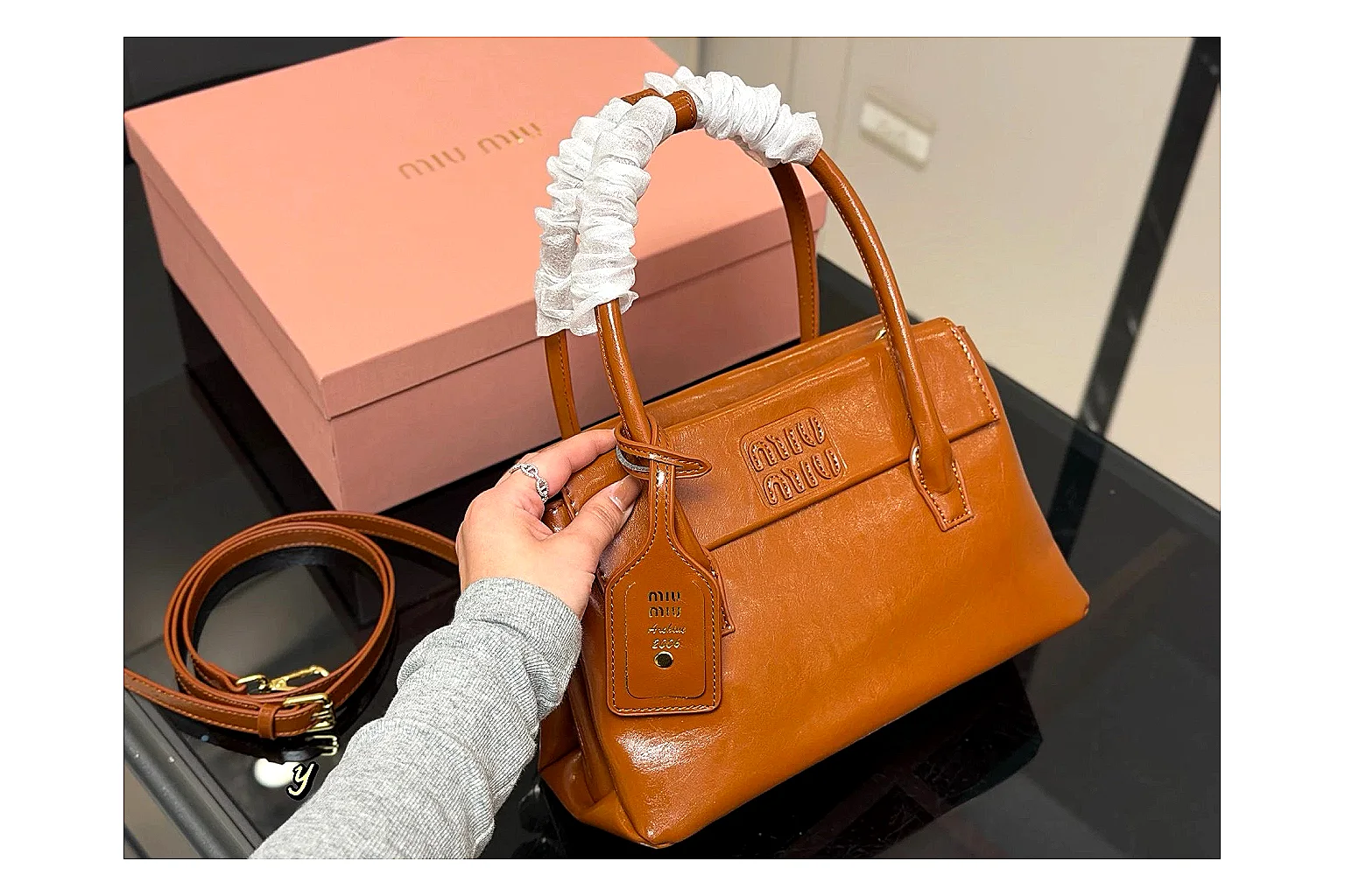 Prada Mini Top Handle Orange Brown budget find photo showing orange brown leather mini bag body, structured top handle, compact shape, and clean hardware details thumbnail 2
