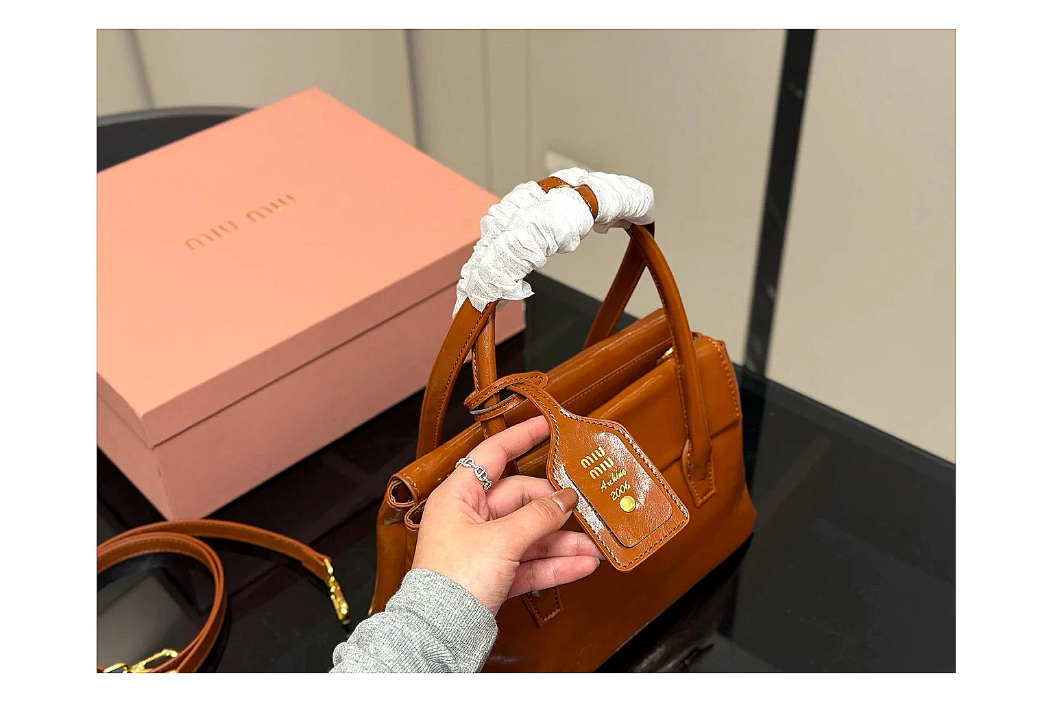 Prada Mini Top Handle Orange Brown budget find photo showing orange brown leather mini bag body, structured top handle, compact shape, and clean hardware details thumbnail 3