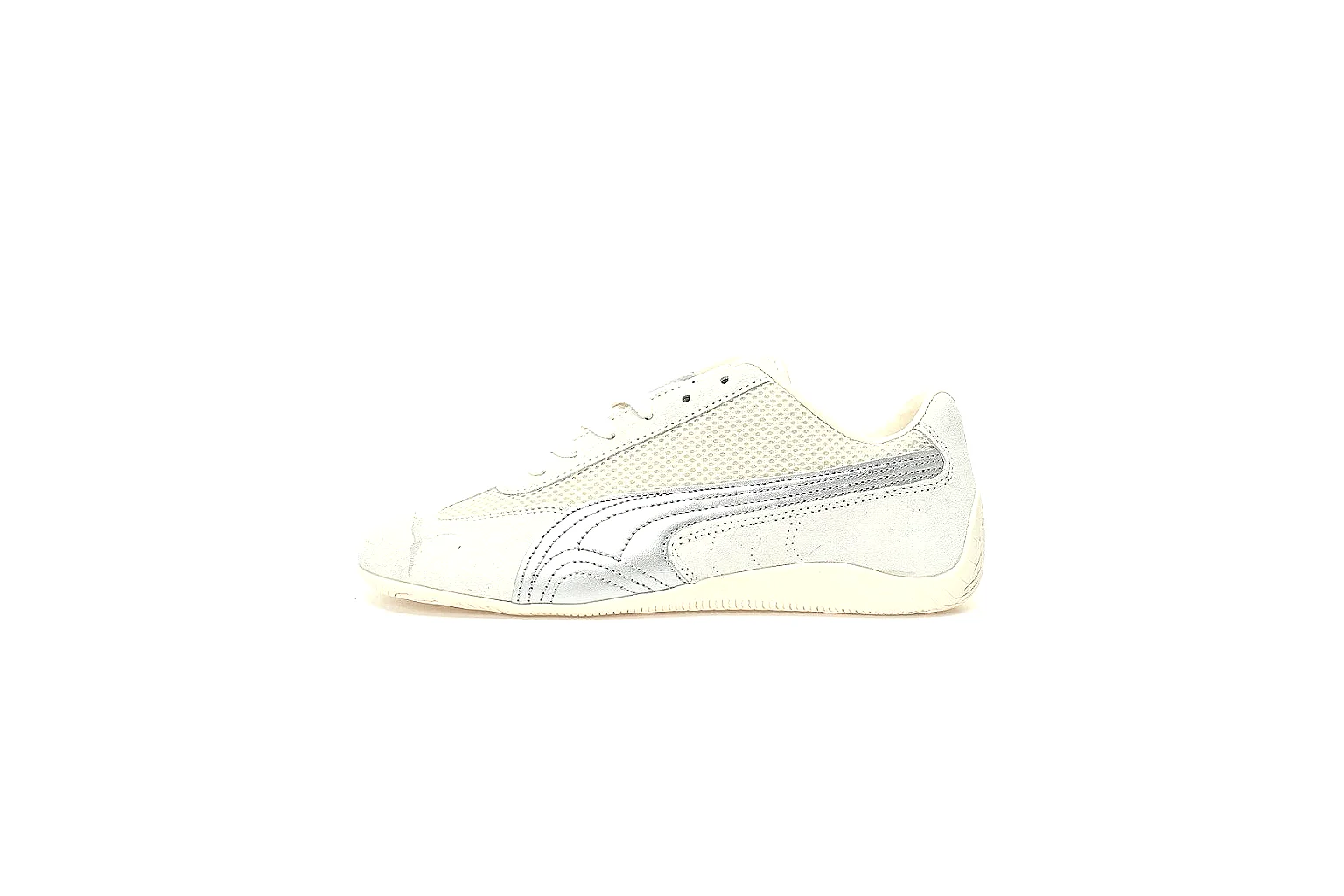 Puma white low-profile trainer photographed from the side