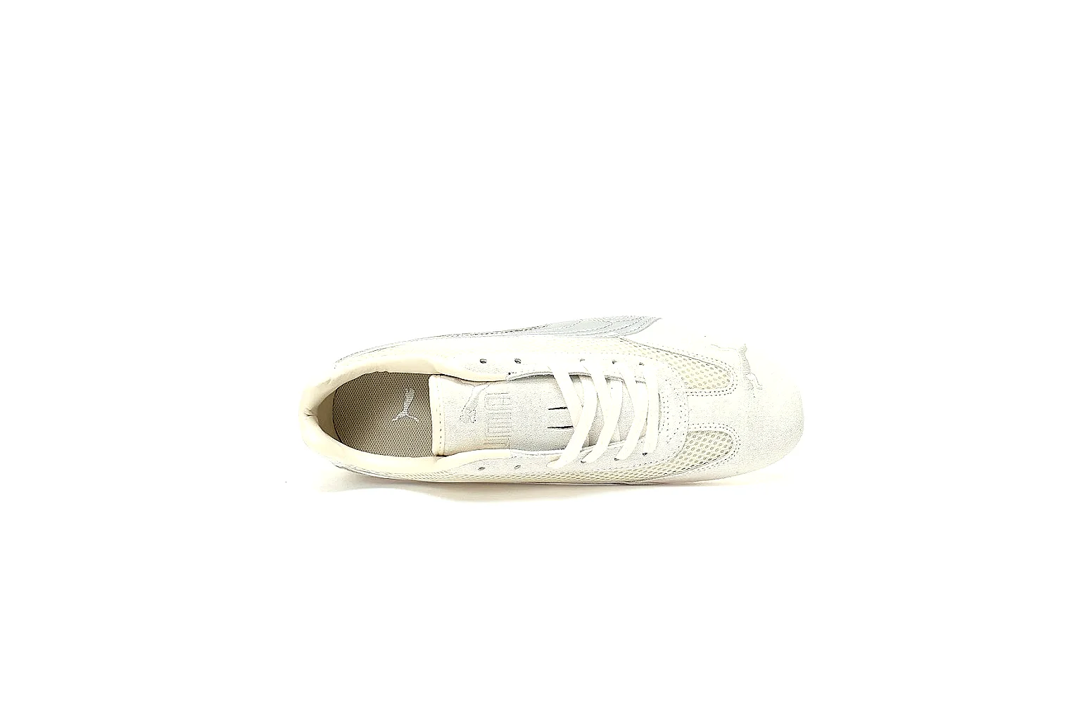 Puma white low-profile trainer photographed from the side thumbnail 4